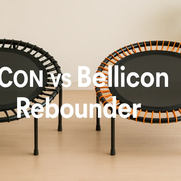 side-by-side-comparison-of-two-premium-fitness-rebounders-one-with-black-bungees-and-one-with-orange-bungees-on-light-wooden-floor-text-in-centre-reading-acon-vs-bellicon-rebounder