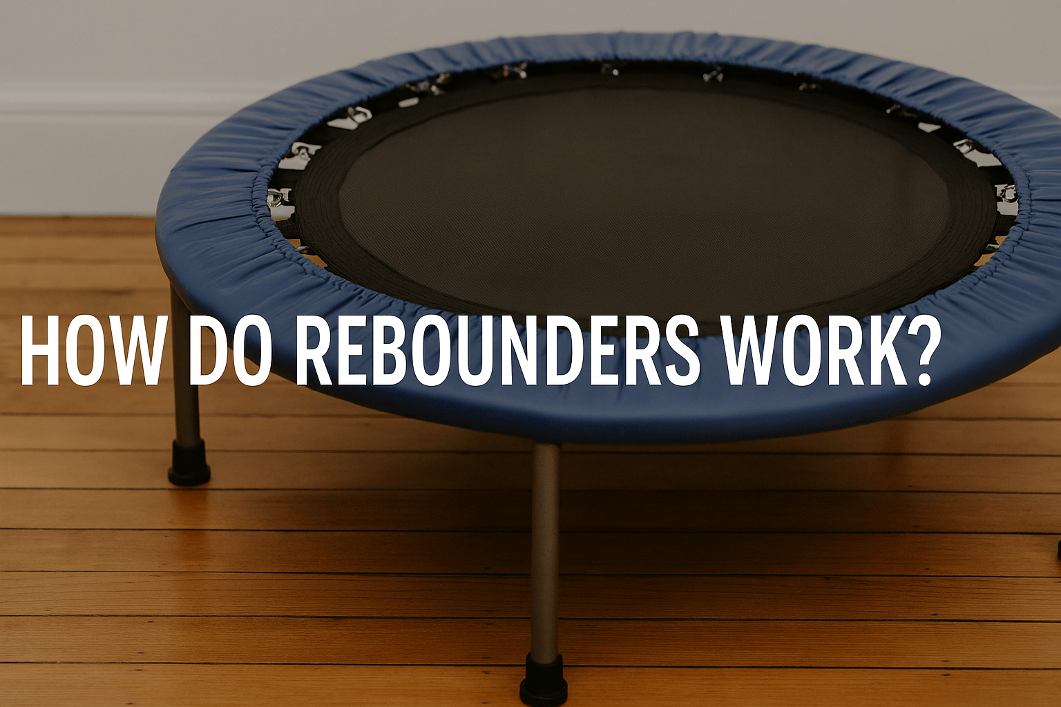 rebounder-uk-mini-trampoline-on-wooden-floor-with-blue-padding-and-black-mat-text-overlay-how-do-rebounders-work-center-aligned