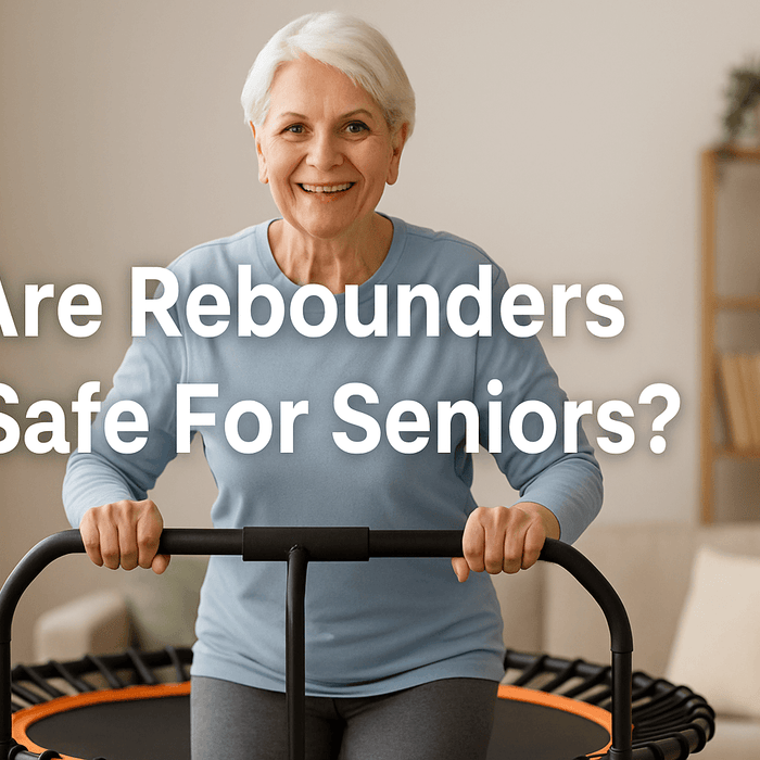 elderly-woman-smiling-while-bouncing-on-rebounder-uk-with-stability-bar-in-living-room-safe-exercise-for-seniors-active-ageing-fitness