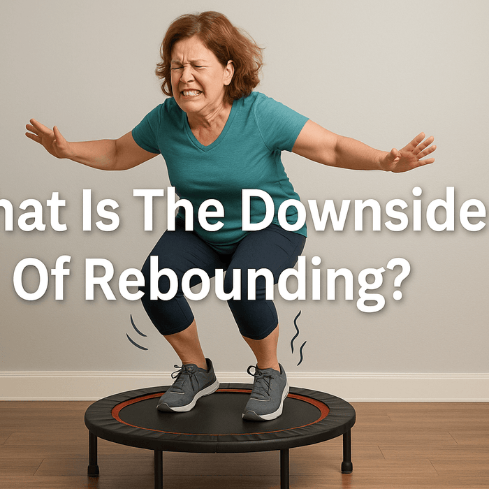 middle-aged-woman-struggling-to-balance-on-rebounder-uk-indoor-wooden-floor-wearing-teal-top-and-navy-leggings