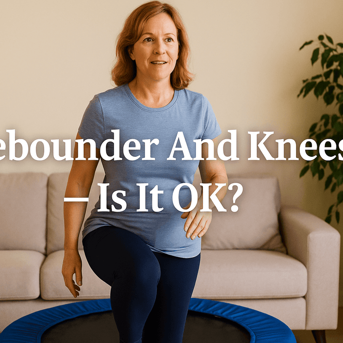 middle-aged-woman-exercising-on-fitness-trampoline-in-living-room-smiling-and-lifting-knee-soft-cushioned-bounce-low-impact-exercise-for-knee-health