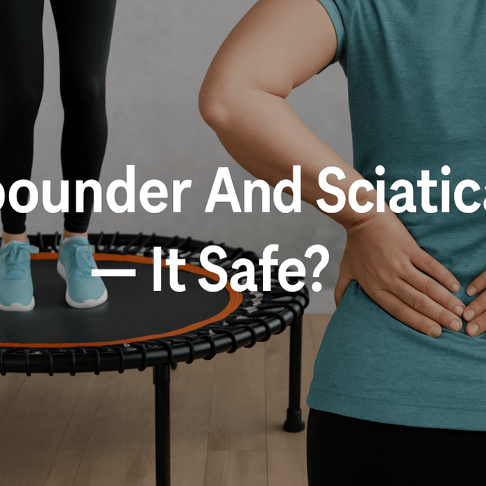 woman-holding-lower-back-in-pain-next-to-fitness-trampoline-with-person-bouncing—blog-banner-text-rebounder-and-sciatica-is-it-safe