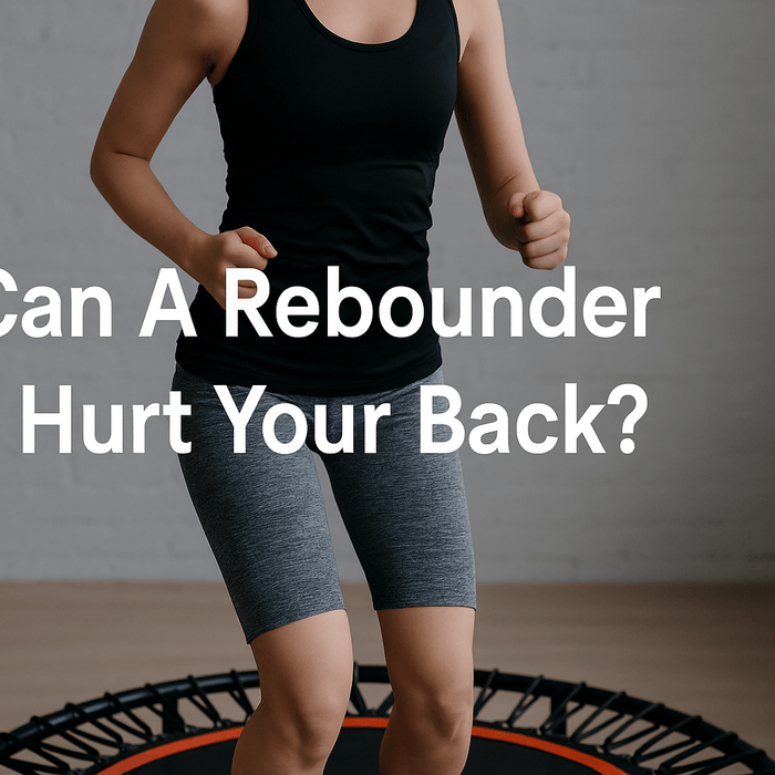 woman-bouncing-on-fitness-trampoline-in-living-room-with-blog-title-can-a-rebounder-hurt-your-back-centered-on-image