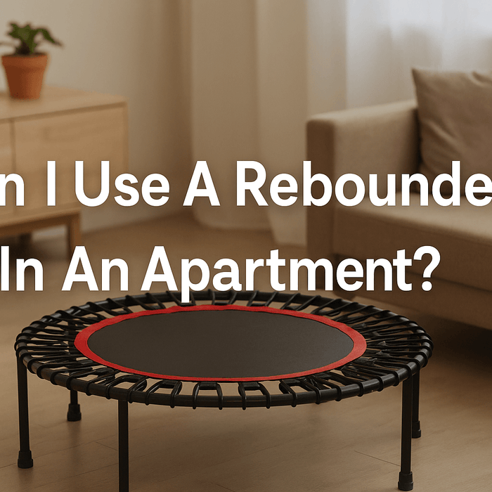 modern-apartment-living-room-with-mini-trampoline-on-mat-wooden-floor-light-sofa-potted-plant-bright-natural-light-blog-title-text-can-i-use-a-rebounder-in-an-apartment-center-aligned