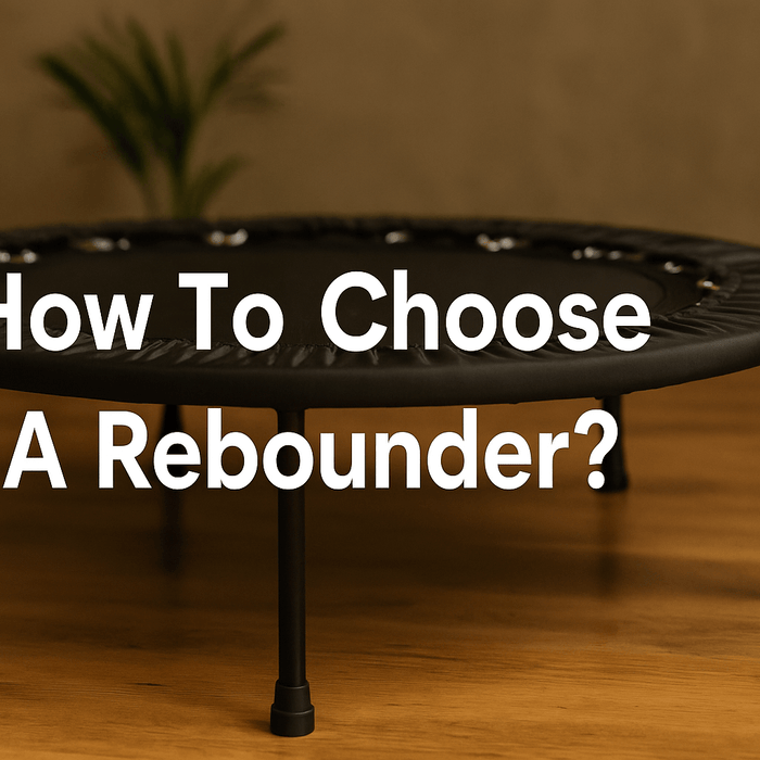 how-to-choose-a-rebounder-banner-showing-black-mini-trampoline-on-wooden-floor-in-home-setting-with-title-text-how-to-choose-a-rebounder-centered-on-image-best-mini-trampoline-for-adults