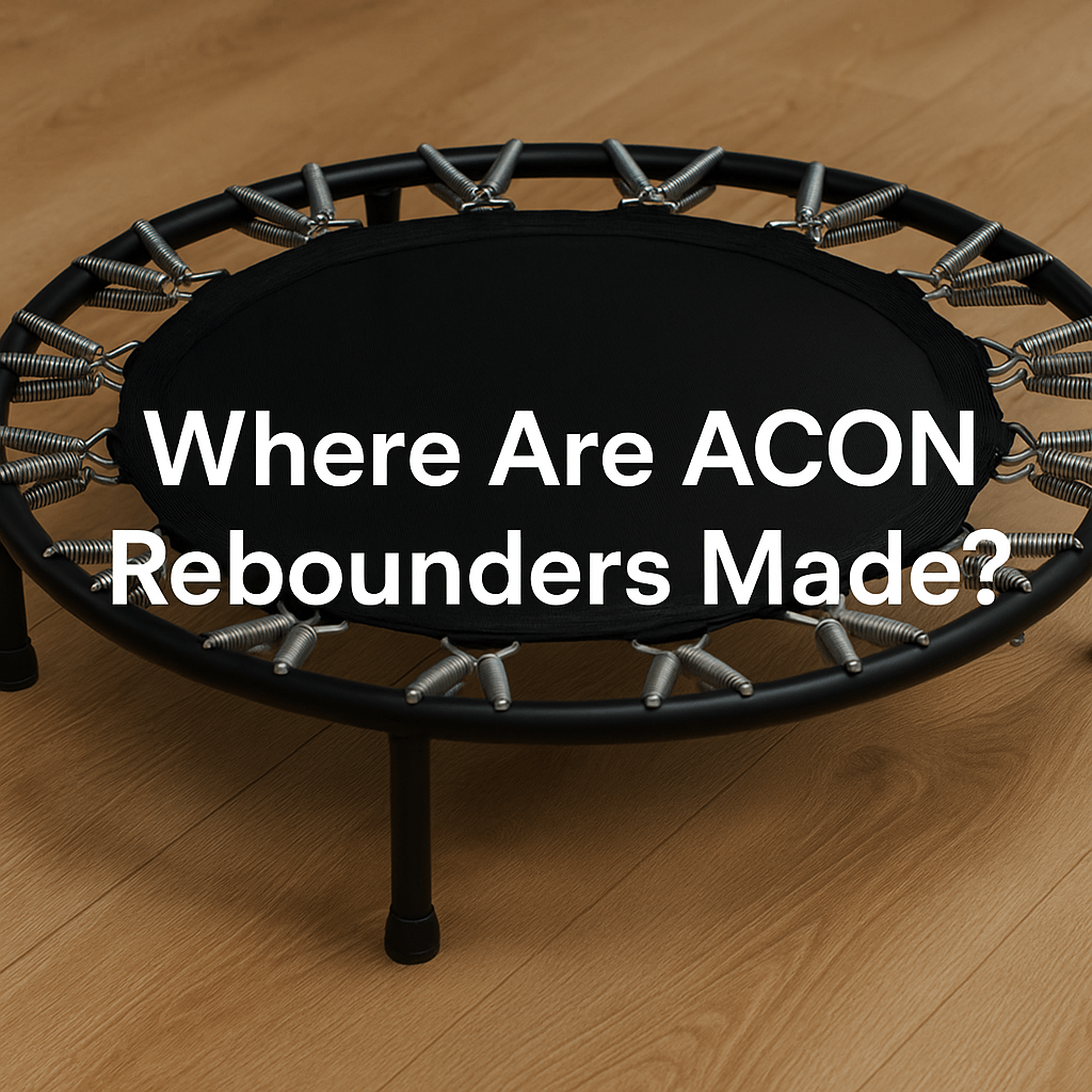 acon-rebounder-on-wooden-floor-with-metal-springs-and-black-mat-bold-white-text-in-centre-reading-where-are-acon-rebounders-made