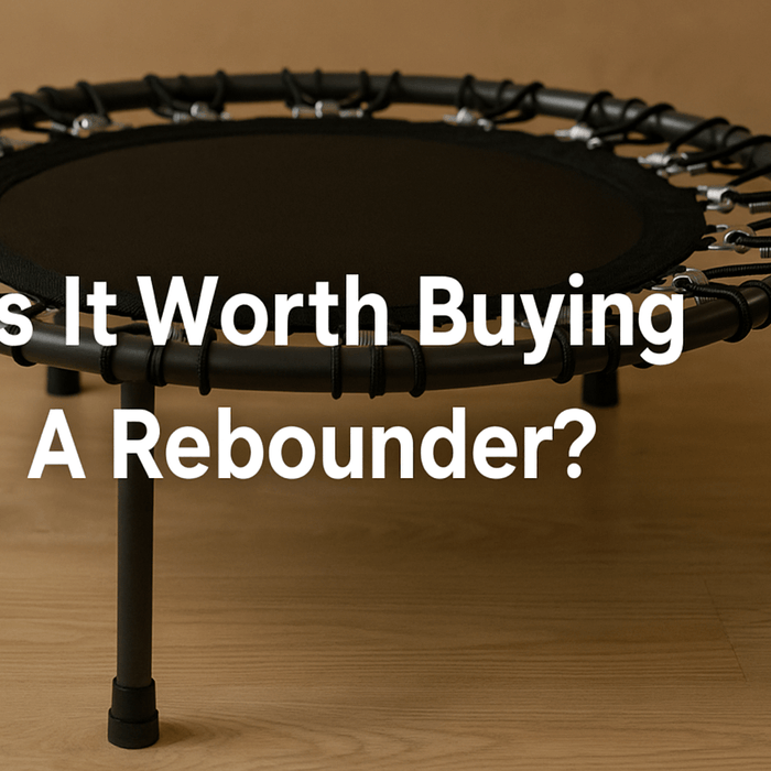 rebounder-trampoline-on-wooden-floor-with-title-is-it-worth-buying-a-rebounder-text-centred-rebounder-trampoline-benefits-uk