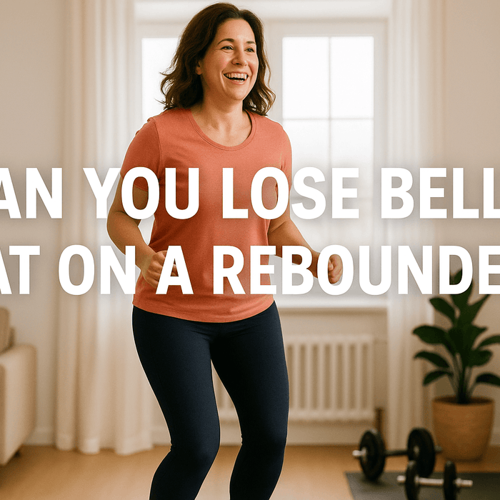 woman-bouncing-on-rebounder-trampoline-in-living-room-smiling-wearing-coral-top-and-navy-leggings