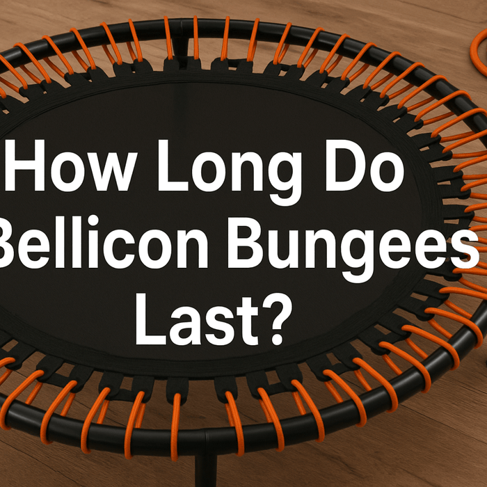 bellicon-mini-trampoline-with-orange-bungee-cords-on-wooden-floor-close-up-of-bungees-text-how-long-do-bellicon-bungees-last-centered-in-white