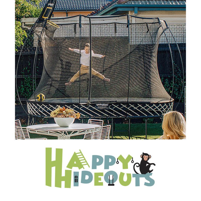 Oval-trampoline-in-ground-with-girl-jumping-in-garden