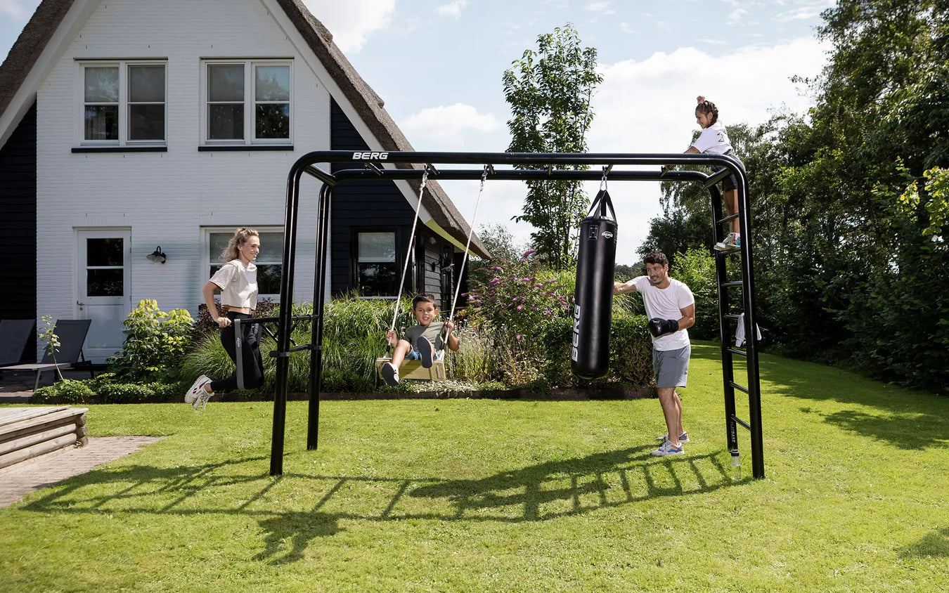 Whole-family-using-the-monkey-bars-for-children