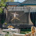 11ft_x_8ft_Springfree_Medium_Oval_Trampoline_mum_and_son_outside