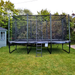 16HD-ACON-Trampoline-In-Garden-with-trees-in-the-background