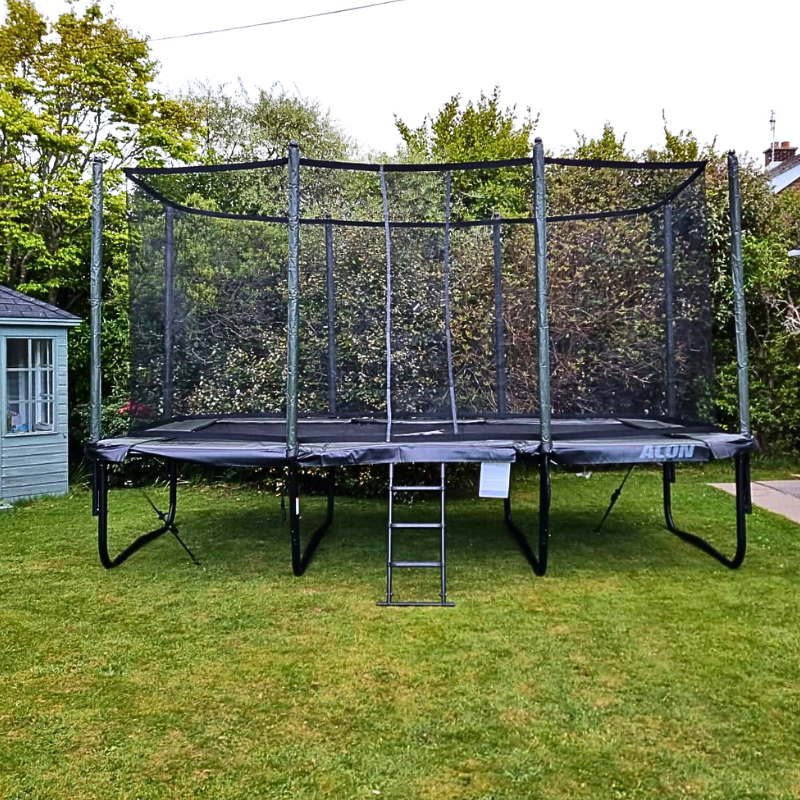 16HD-ACON-Trampoline-In-Garden-with-trees-in-the-background