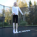 ACON-Air-12ft-Round-Trampoline-child-standing-on-branded-jump-mat