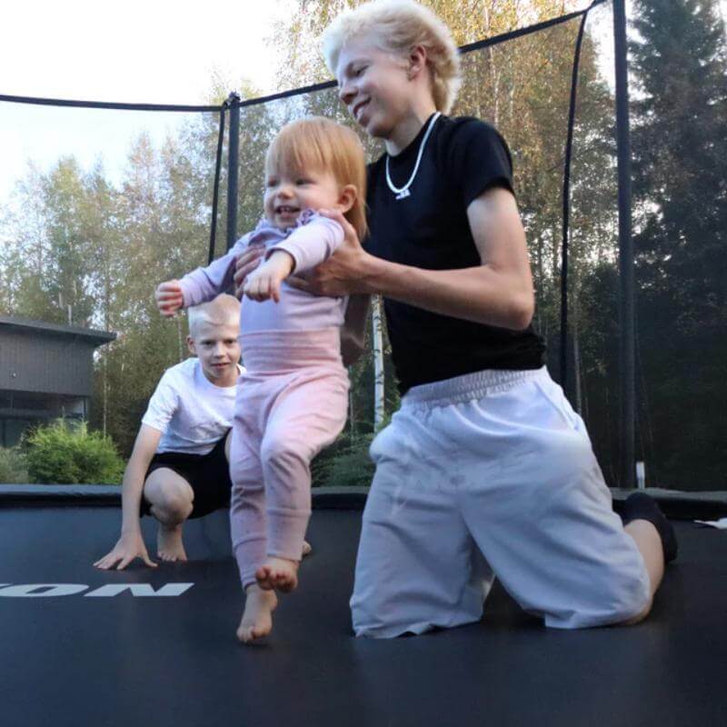 ACON-Air-14ft-Round-Trampoline-children-playing-together-on-mat