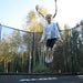 ACON-Air-14ft-Round-Trampoline-girl-bouncing-high-in-garden