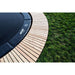 ACON-Air-14ft-Round-Trampoline-pad-logo-close-up-with-wooden-surround
