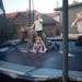ACON-Air-15ft-Round-Trampoline-family-playtime-on-bounce-mat