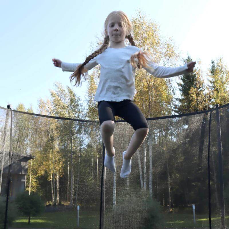 ACON-Air-15ft-Round-Trampoline-girl-jumping-inside-safety-net