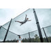 ACON-X-Trampoline-athlete-jumping-high-against-safety-net