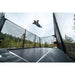 ACON-X-Trampoline-athlete-performing-high-air-jump-inside-enclosure