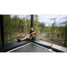 ACON-X-Trampoline-with-adult-sitting-beside-forest-view
