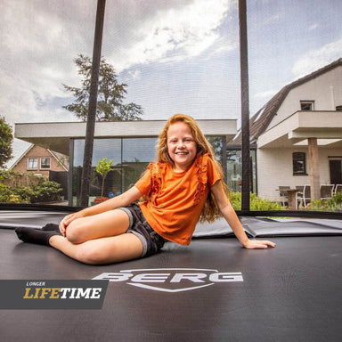 BERG_Favorit_Rectangular_inground_Trampoline_girl_smiling