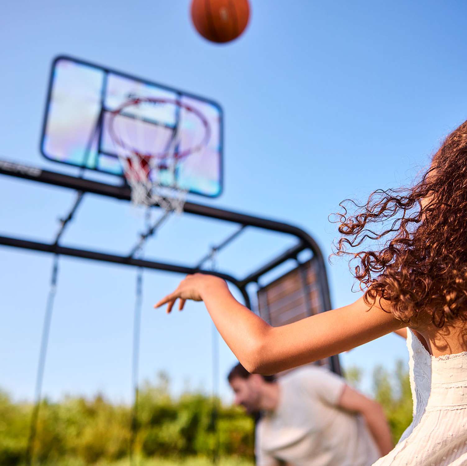 BERG Playbase Basketball Hoop with girl playing in the garden