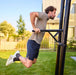 BERG Playbase Dip Bar with man in the garden