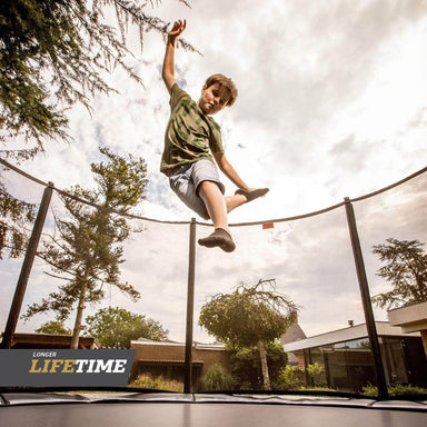 BERG_trampoline_Favorit_14ft_regular_boy_playing