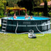 Family in Intex XTR 18x52 pool in the garden