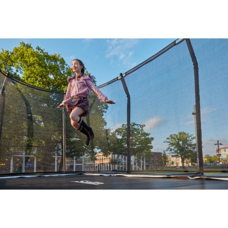 Salta_Rectangular_Trampoline_396x244cm_Black_Edition_woman_playing