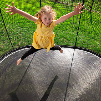 Springfree_Compact_Oval_Trampoline_lifestyle_girl