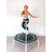 Woman-bouncing-on-white-ACON-rebounder-with-handle