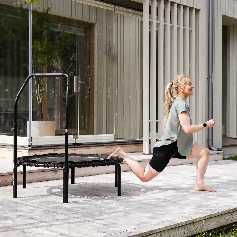 Woman-lunging-on-black-ACON-rebounder-on-patio