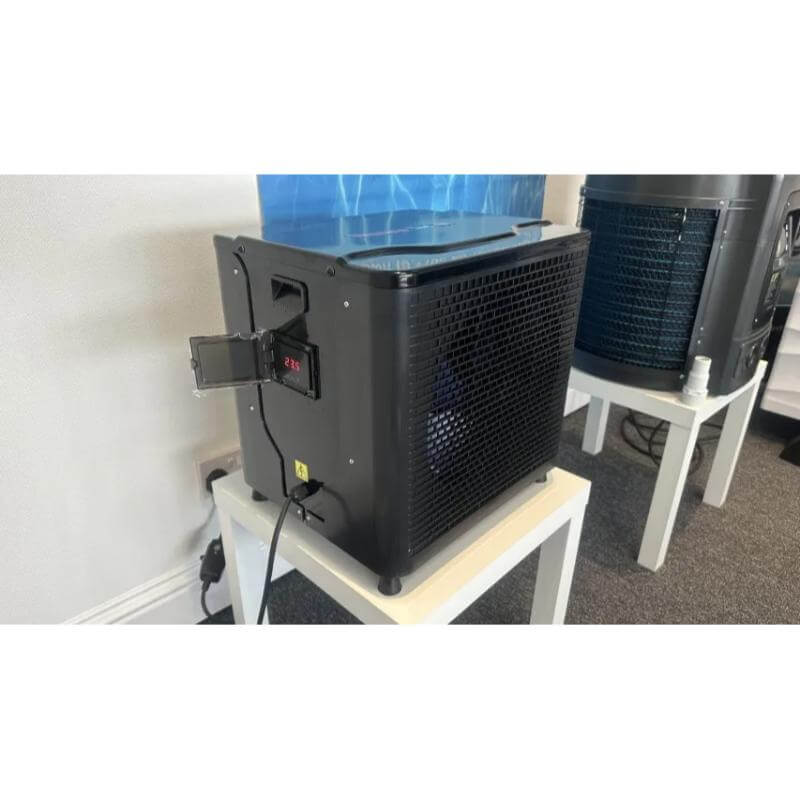 above-ground-pool-heater-uk-thermotec-mini-heat-pump-installed-with-water-inlet-and-outlet-connections