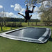 adult-doing-backflip-on-north-17ft-x-12ft-rectangular-inground-trampoline