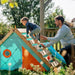 adult-helping-child-climb-wooden-ramp-on-triangular-playcentre