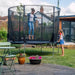 adult-jumping-on-plum-spacezone-trampoline-while-child-watches