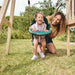 adult-pushing-toddler-on-green-bucket-swing-under-wooden-playcentre