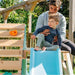 adult-supporting-child-at-top-of-blue-slide-on-wooden-playcentre