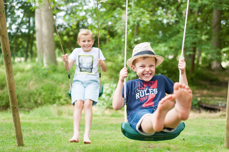 angled-hero-shot-of-the-plum-gibbon-wooden-swing-set-featuring-two-green-swings-and-a-knotted-climbing-rope-attachment