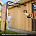 berg-playbase-wall-swing-use-along-wall-with-father-and-son-enjoying-the-swing