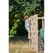 boy-climbing-up-wooden-rock-wall-with-blue-grips-on-plum-climbing-cube