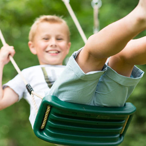 boy-enjoying-green-belt-swing-seat-in-garden-close-up
