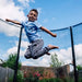 boy-jumping-inside-plum-spacezone-trampoline-low-angle-view