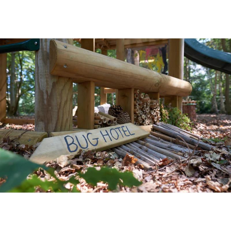 bug-hotel-made-from-bamboo-pinecones-and-twigs-under-wooden-playcentre