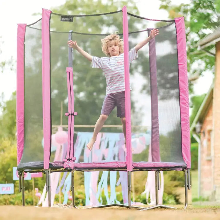 child-bouncing-inside-pink-junior-trampoline-with-safety-net