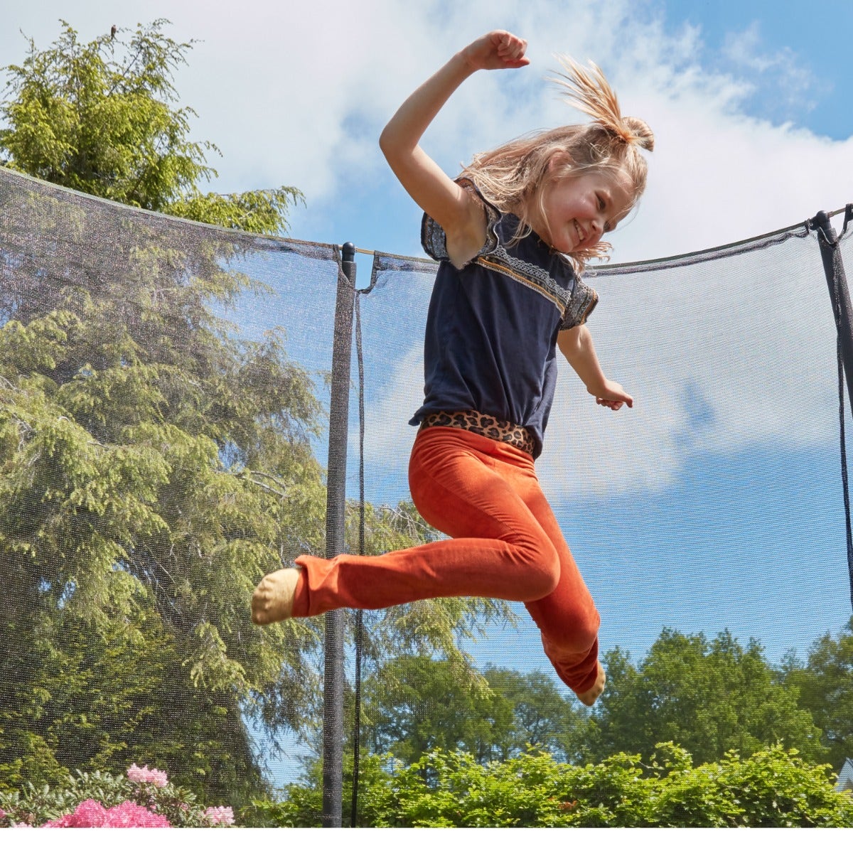 child-bouncing-on-salta-comfort-edition-inground-trampoline